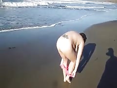 Walking naked at the beach