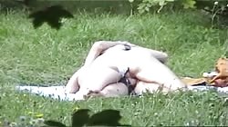 Astonishing outdoor sex on the grass with a Russian milf
